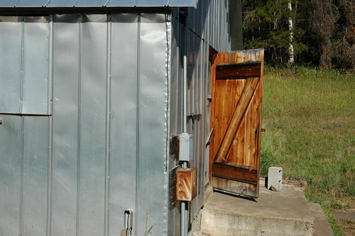Sheet Metal Building and Wooden Door